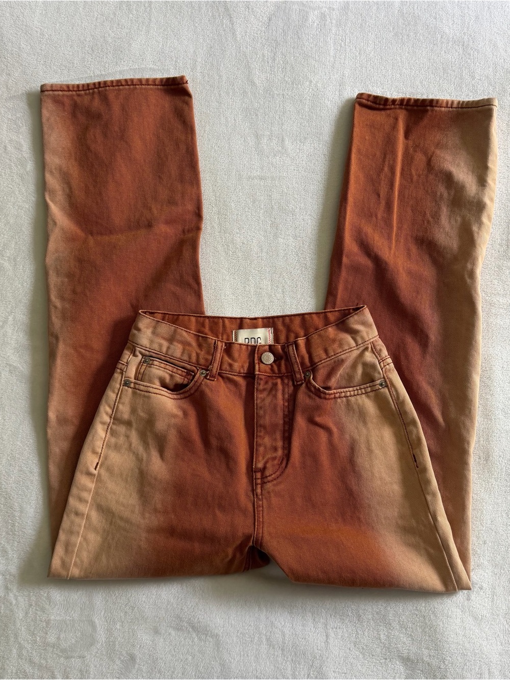 BDG High Waisted Cowboy Jean Ombre
Womens Size 24 Piece-Dye Colored Denim Rust